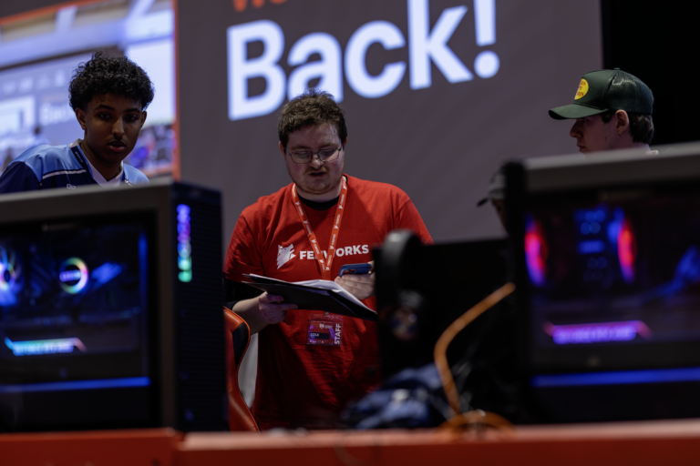 Esports coach working with a student team in Minnesota