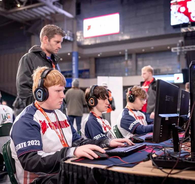 Esports coach working with a student team in North Dakota