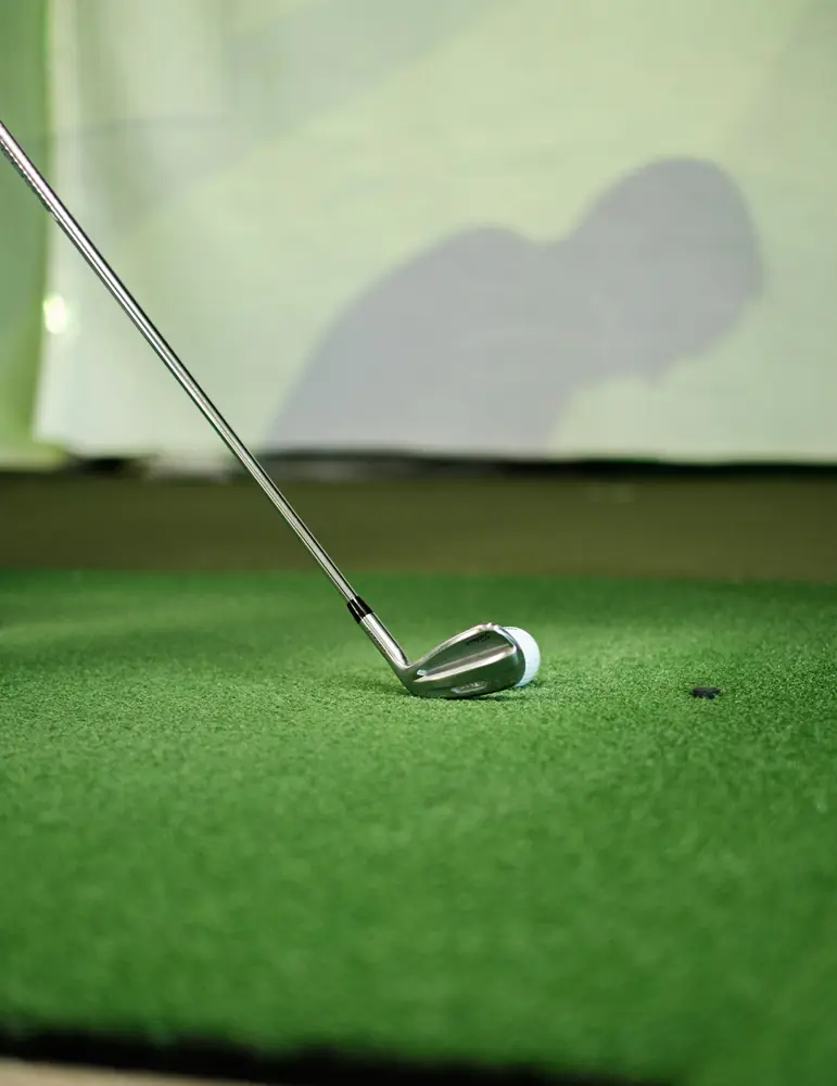 Student competing in Fenworks STEM programs for schools on a golf simulator